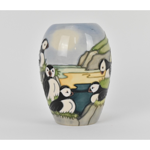 141 - A Moorcroft ceramic baluster vase in the 'Puffin' pattern designed by Carol Lovett, 1997, with impre... 