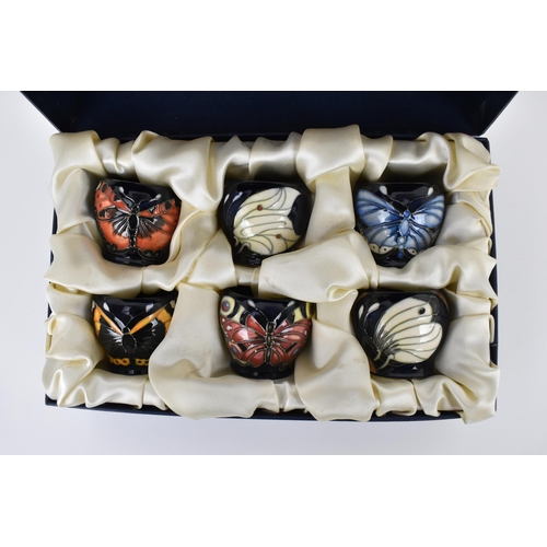 142 - A limited edition Moorcroft ceramic set of six egg cups, designed by Rachel Bishop, in a tubelined b... 
