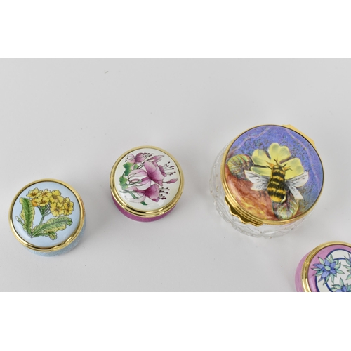144 - A collection of Moorcroft Enamels Ltd pill boxes and a cut glass enamel lidded box, by various artis... 