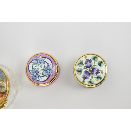 144 - A collection of Moorcroft Enamels Ltd pill boxes and a cut glass enamel lidded box, by various artis... 