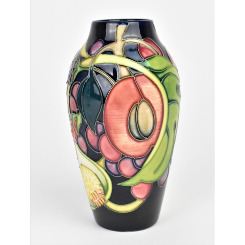 149 - A Moorcroft pottery Queens Choice pattern vase by Emma Bossons, decorated with tubelined fruit and f... 