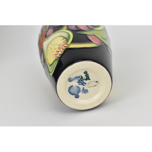 149 - A Moorcroft pottery Queens Choice pattern vase by Emma Bossons, decorated with tubelined fruit and f... 