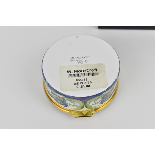 152 - A Moorcroft Enamels Ltd box with hinged lid, in the 'Teasel' pattern, 2004, designed by Philip Gibso... 