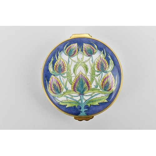 152 - A Moorcroft Enamels Ltd box with hinged lid, in the 'Teasel' pattern, 2004, designed by Philip Gibso... 