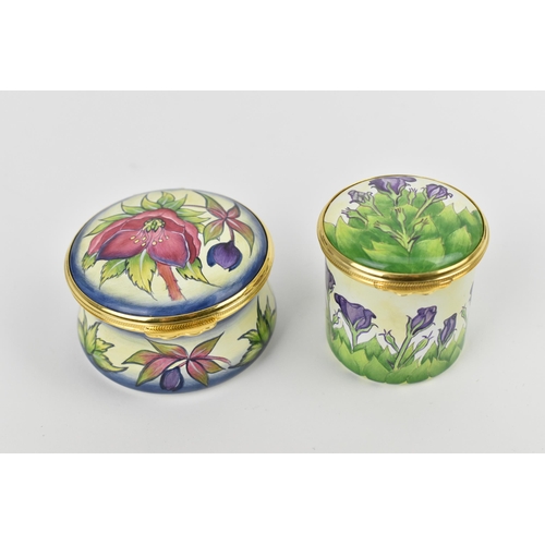 153 - Two Moorcroft Enamels Ltd boxes with hinged lids, both with floral design, the larger one in the 'he... 