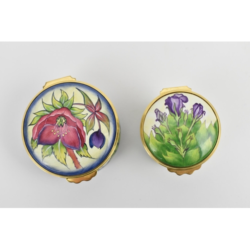 153 - Two Moorcroft Enamels Ltd boxes with hinged lids, both with floral design, the larger one in the 'he... 