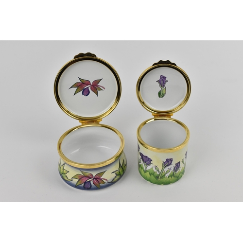 153 - Two Moorcroft Enamels Ltd boxes with hinged lids, both with floral design, the larger one in the 'he... 