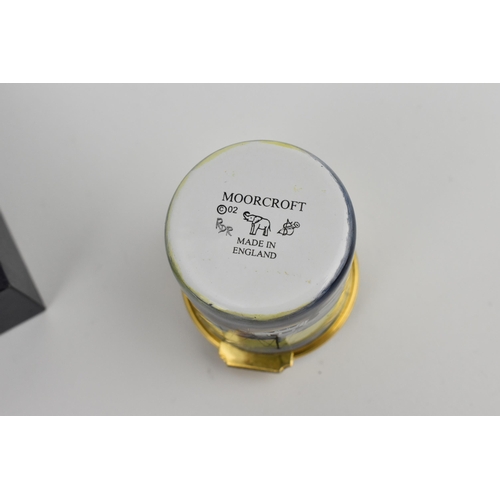 154 - A Moorcroft Enamels Ltd box with hinged lid, the nautical pattern with boats in a harbour, designer'... 