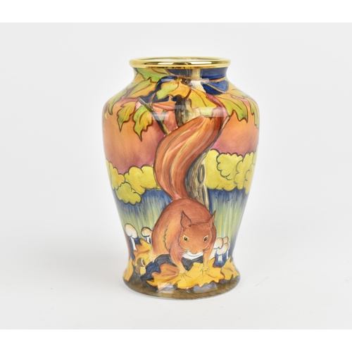 155 - A Moorcroft Enamels Ltd miniature baluster vase, painted with squirrels foraging, with artists initi... 