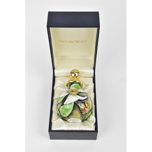 157 - A Moorcroft Enamels Ltd perfume bottle with gilt stopper, designed by Philip Gibson and painted by E... 