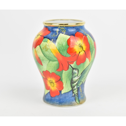 158 - A Moorcroft Enamels Ltd miniature baluster vase, painted by Faye Williams with hummingbirds drinking... 