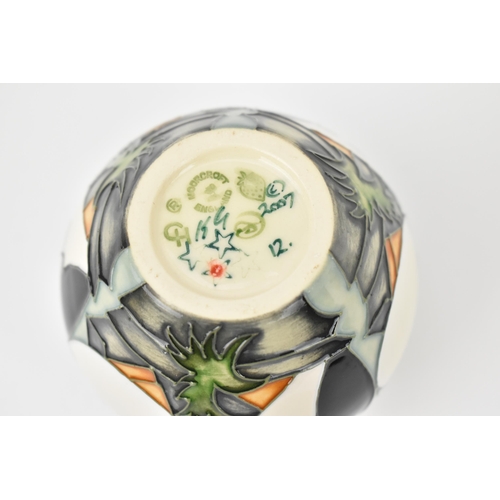 162 - A small Moorcroft pottery vase in the 'Puffins' pattern by Kerry Goodwin, 2007, with various impress... 