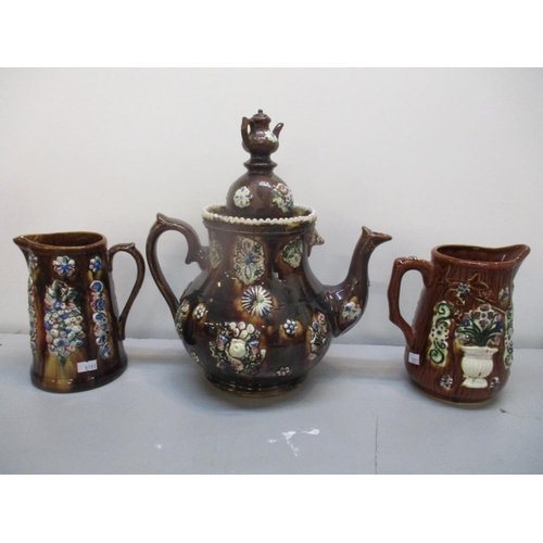 114 - A Victorian barge ware pottery large teapot, together with two jugs
Location: 4.1