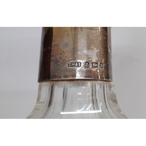 108 - Two Victorian clear glass decanters with gilt ornament, a decanter with a silver collar, another fas... 