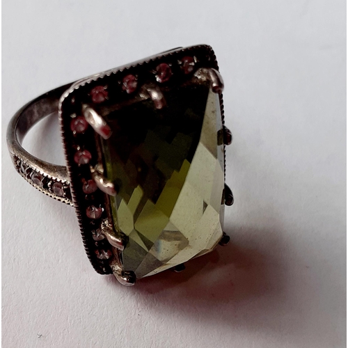 80 - Five Modernist silver and silver tone fashion rings with coloured cabochons, total weight 79.2g. Loc... 