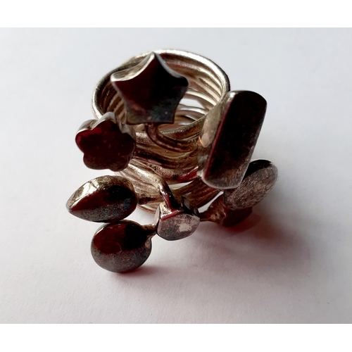 80 - Five Modernist silver and silver tone fashion rings with coloured cabochons, total weight 79.2g. Loc... 