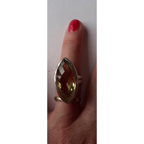 80 - Five Modernist silver and silver tone fashion rings with coloured cabochons, total weight 79.2g. Loc... 