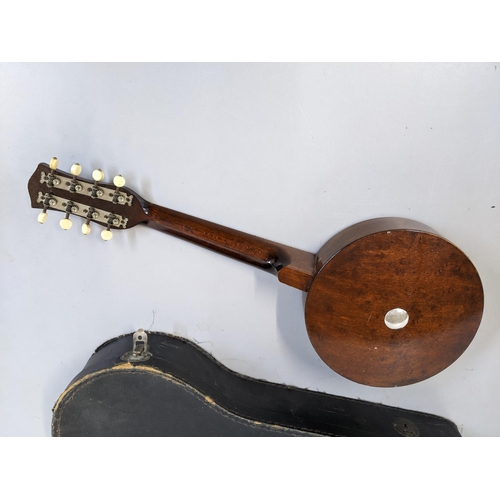 109 - A vintage mandolin, 56cm long, in a carrying case
Location: FSL