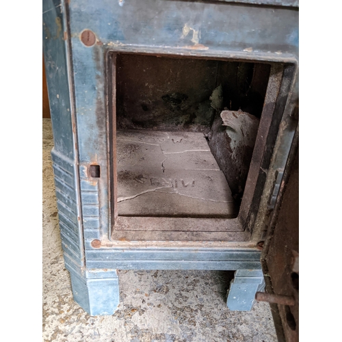 184 - An early 20th century French enamelled wood burning stove in blue with side access
Location: G