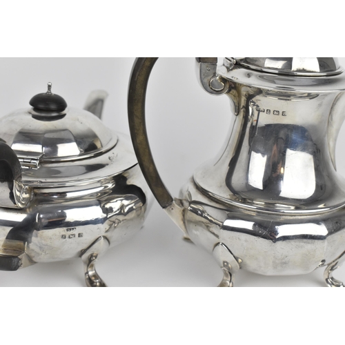 124 - A George V silver teapot and hot water pot by Docker & Burn Ltd, Birmingham 1924, with faceted bodie... 