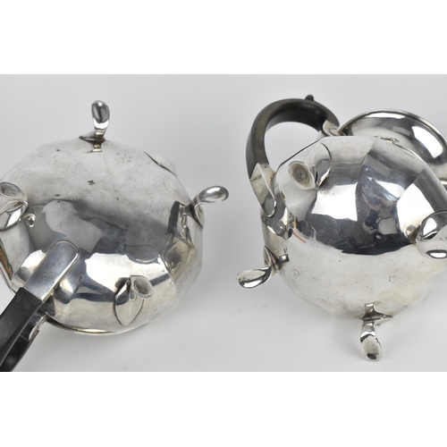 124 - A George V silver teapot and hot water pot by Docker & Burn Ltd, Birmingham 1924, with faceted bodie... 