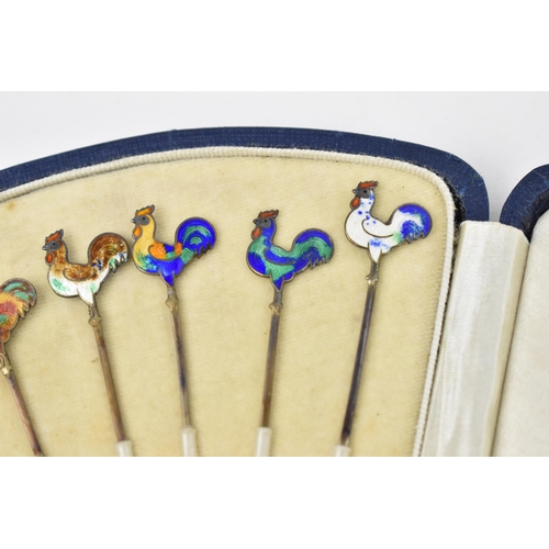 129 - A cased set of six Art Deco sterling silver and enamel cocktail sticks with cockerel finials, in fit... 