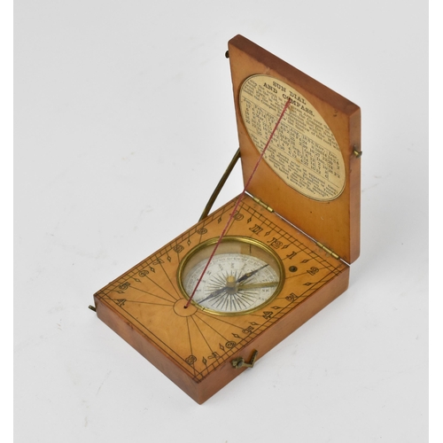 130 - A 19th century pocket sun dial and compass, within wooden case, the top with etched plate 'Hutton Tr... 