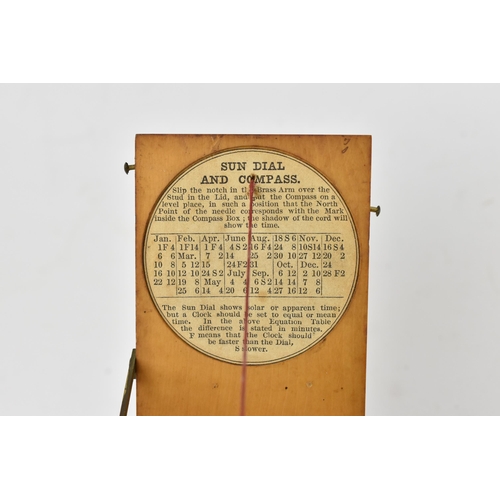 130 - A 19th century pocket sun dial and compass, within wooden case, the top with etched plate 'Hutton Tr... 