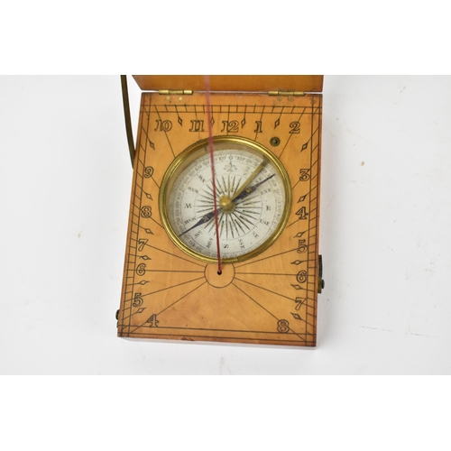 130 - A 19th century pocket sun dial and compass, within wooden case, the top with etched plate 'Hutton Tr... 