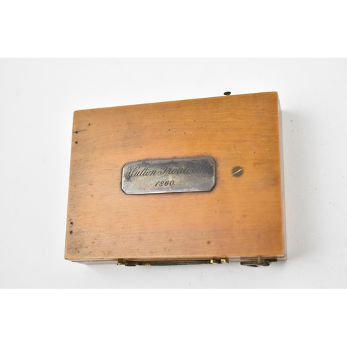 130 - A 19th century pocket sun dial and compass, within wooden case, the top with etched plate 'Hutton Tr... 