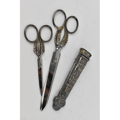 132 - A pair of Victorian silver mounted scissors, Birmingham 1892, in fitted embossed case with smaller p... 