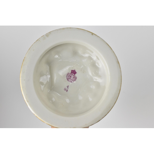 136 - A late 19th century Royal Worcester nautilus spoon warmer of ivory ground with gilt border, on a nat... 