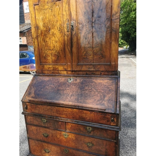 142 - An early 18th century burr walnut bureau cabinet, circa 1720, in the manner of Coxed and Woster, the... 