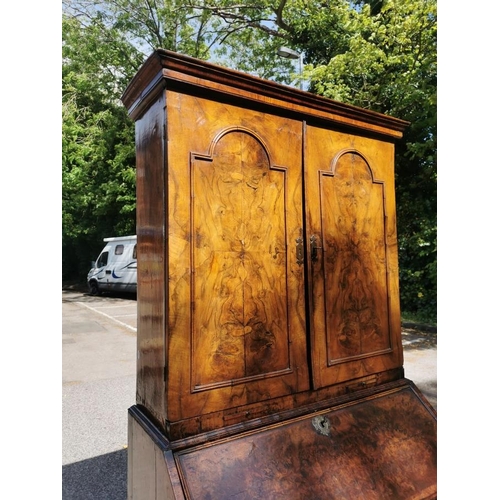 142 - An early 18th century burr walnut bureau cabinet, circa 1720, in the manner of Coxed and Woster, the... 