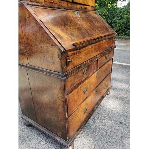 142 - An early 18th century burr walnut bureau cabinet, circa 1720, in the manner of Coxed and Woster, the... 