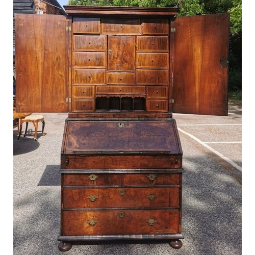 142 - An early 18th century burr walnut bureau cabinet, circa 1720, in the manner of Coxed and Woster, the... 