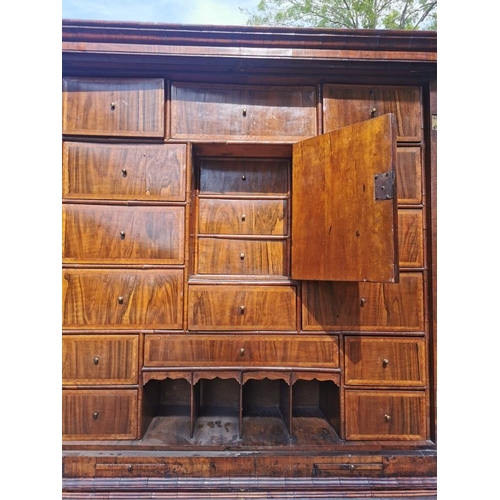 142 - An early 18th century burr walnut bureau cabinet, circa 1720, in the manner of Coxed and Woster, the... 