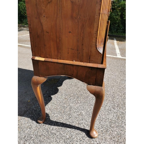 143 - A Queen Anne burr and figured walnut chest on stand, with moulded cavetto cornice above three short ... 