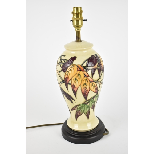 31 - A Moorcroft Pottery Sumac Tree pattern table lamp base designed by Phillip Gibson, the body decorate... 