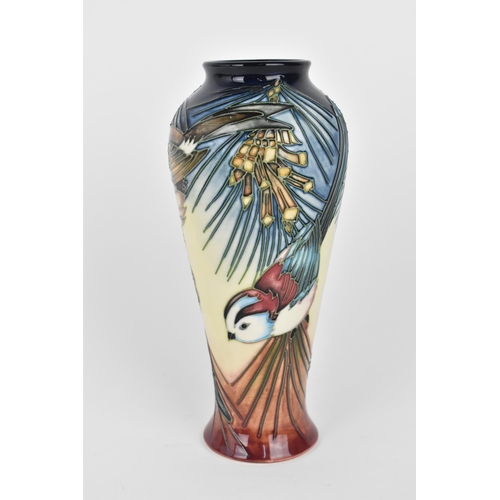 49 - A Moorcroft pottery 'Inglewood' vase designed by Philip Gibson, with tubelined decoration of a robin... 