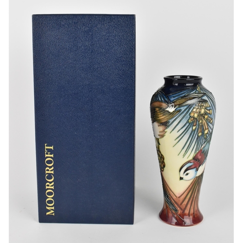 49 - A Moorcroft pottery 'Inglewood' vase designed by Philip Gibson, with tubelined decoration of a robin... 