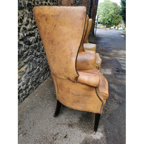 161 - A pair of George III design barrel back armchairs, upholstered in studded tan leather, with button s... 