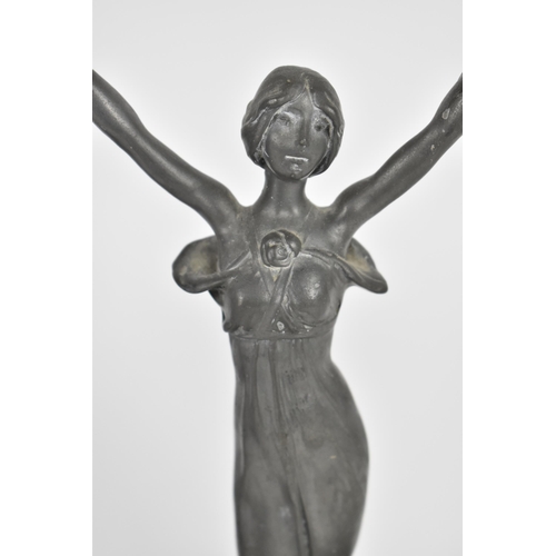 104 - A pair of Art Nouveau pewter figural candelabra, in the WMF style, each modelled as a nymph in flowi... 