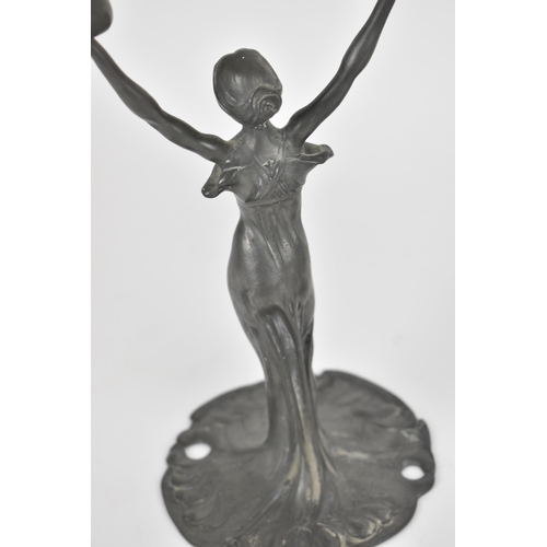 104 - A pair of Art Nouveau pewter figural candelabra, in the WMF style, each modelled as a nymph in flowi... 