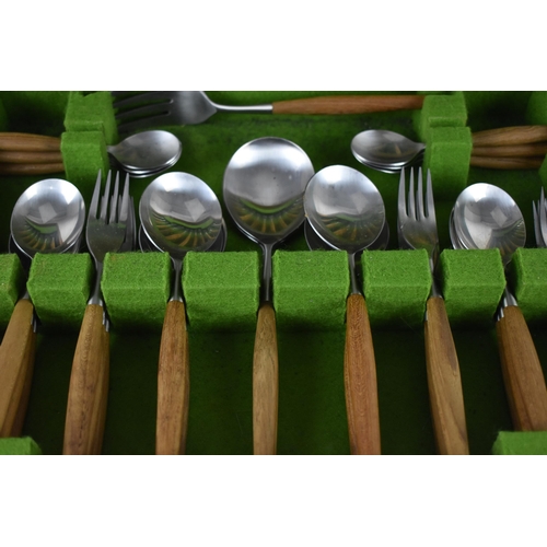 116 - A Norwegian canteen of cutlery by Helle for six settings, mounted with wooden handles, in a fitted c... 