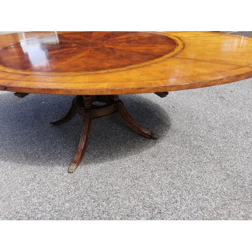 140 - A Regency style flame mahogany and satinwood veneer 'jupe' extending dining table, starting as a cir... 