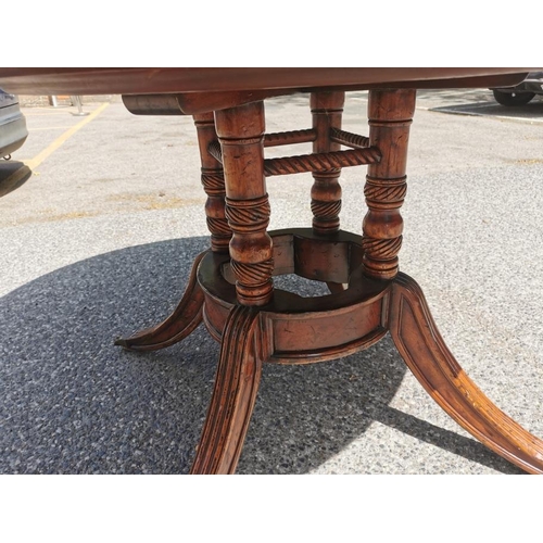 140 - A Regency style flame mahogany and satinwood veneer 'jupe' extending dining table, starting as a cir... 