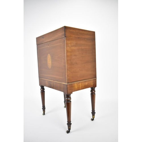 144 - A George III mahogany cellarette, circa 1790, of rectangular form with inlay and box stringing, the ... 