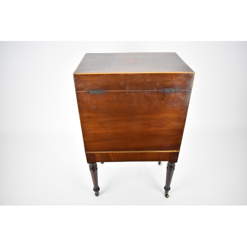 144 - A George III mahogany cellarette, circa 1790, of rectangular form with inlay and box stringing, the ... 