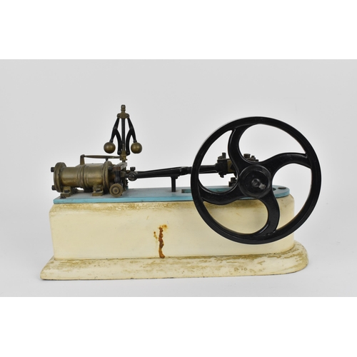 146 - A horizontal steam beam engine, with single cylinder and four-spoke flywheel, on a painted wooden ba... 